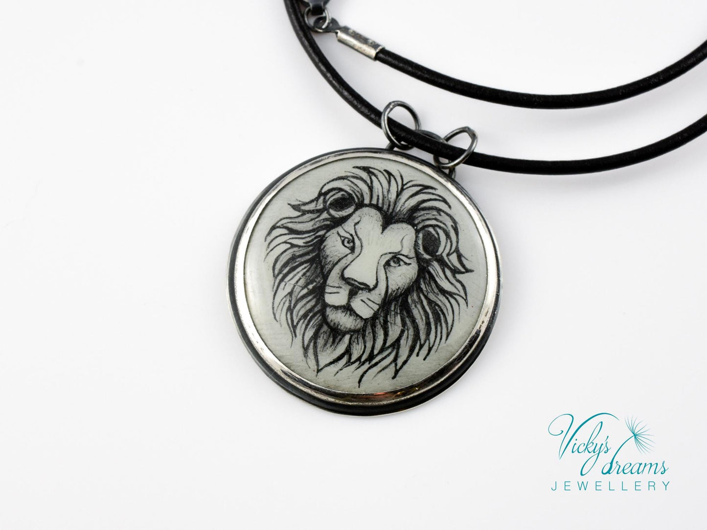 Hand-painted cloisonné enamel pendant featuring a zodiac sign design, set in sterling silver.