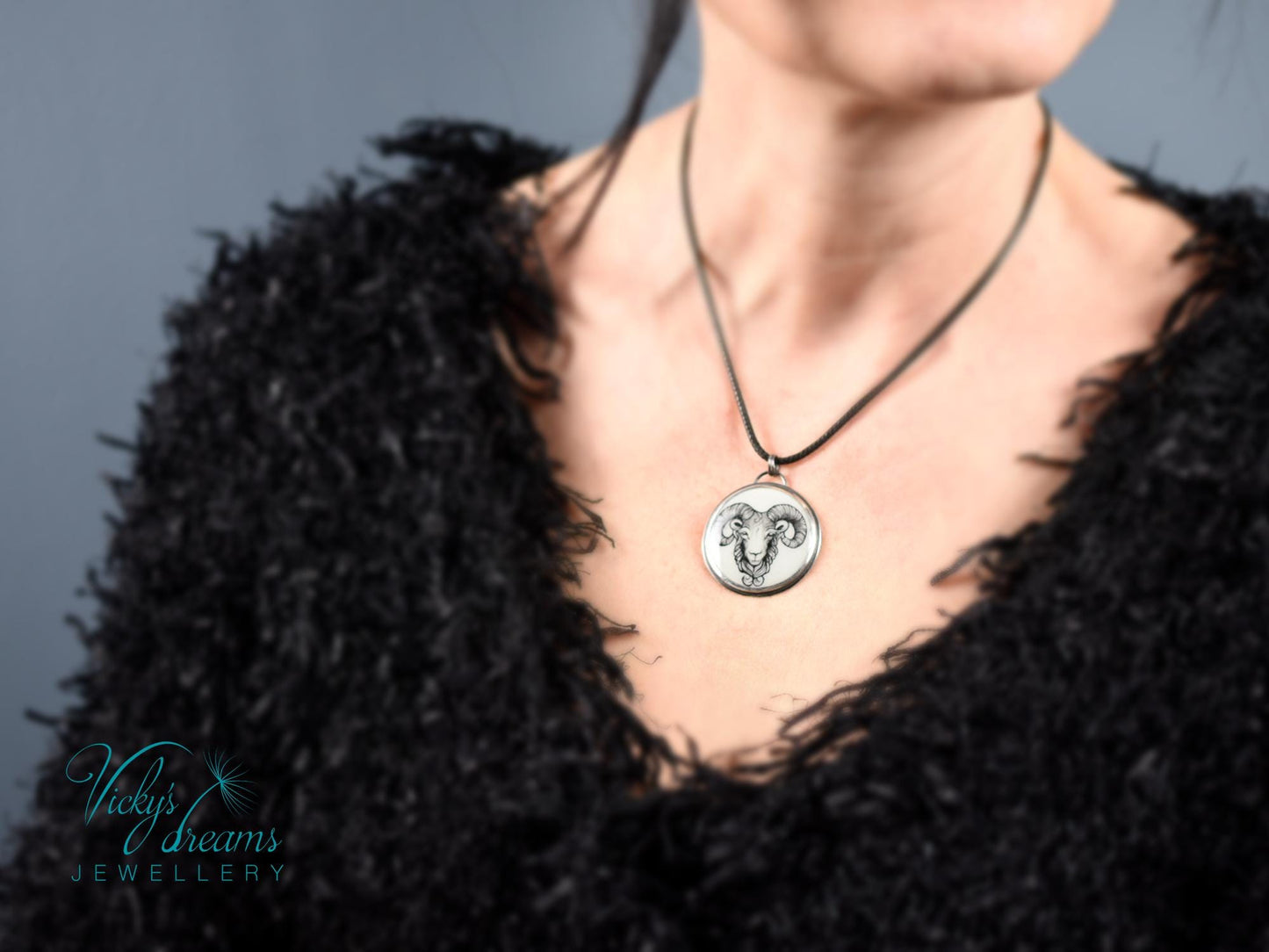 Hand-painted cloisonné enamel pendant featuring a zodiac sign design, set in sterling silver.