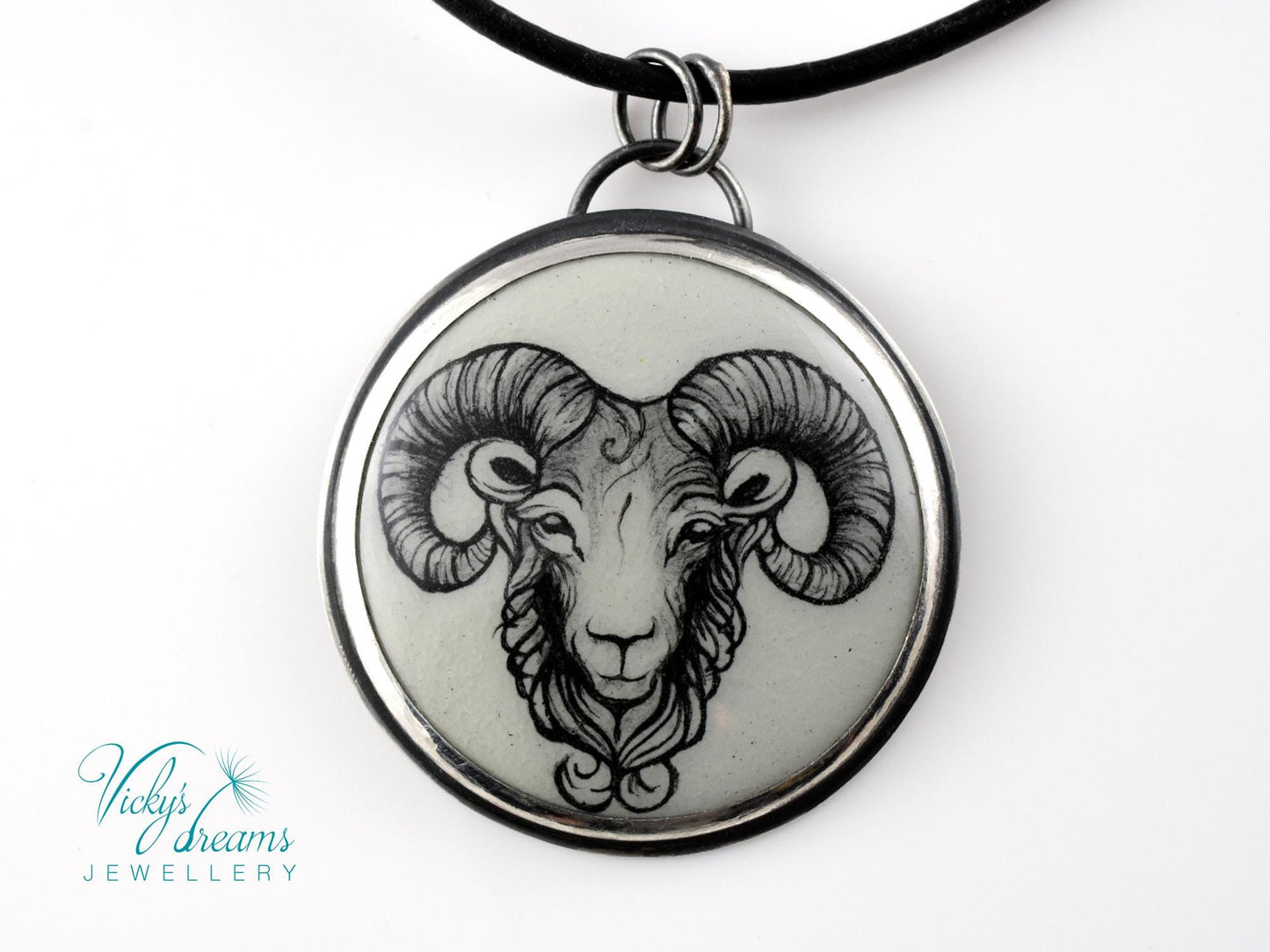 Hand-painted cloisonné enamel pendant featuring a zodiac sign design, set in sterling silver.