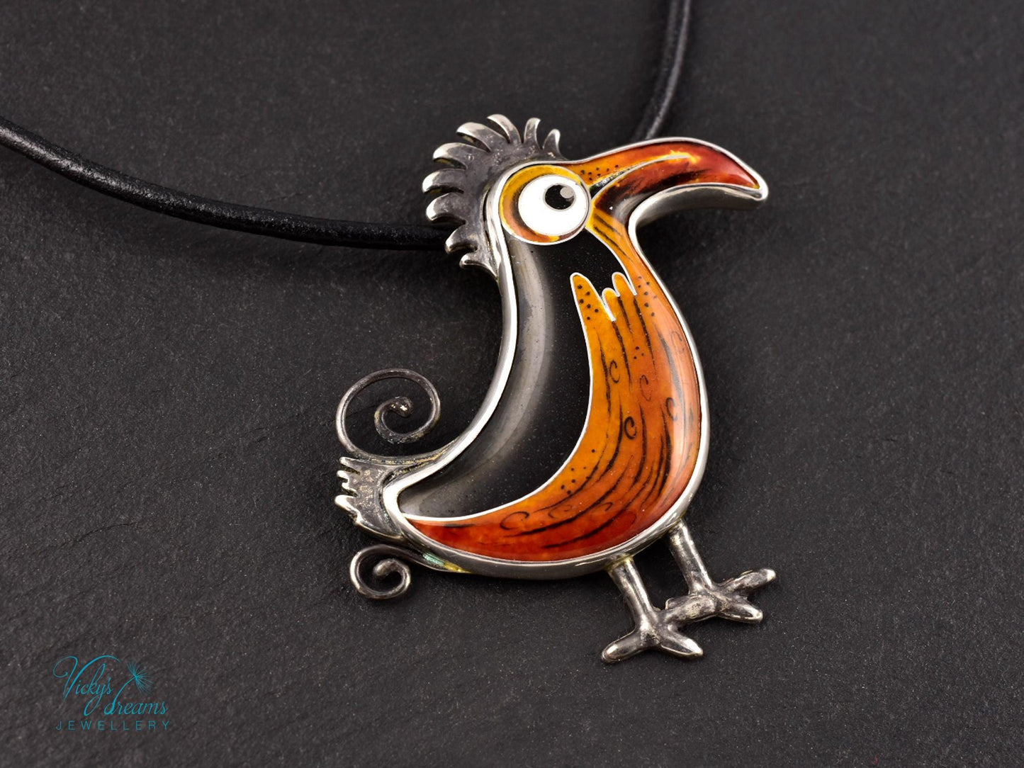 Handcrafted boho birdie pendant with cloisonné enamel and sterling silver frame, unique nature-inspired jewelry piece.