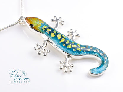 Handcrafted cloisonné enamel necklace with blue, yellow, and orange lizard design set in sterling silver.