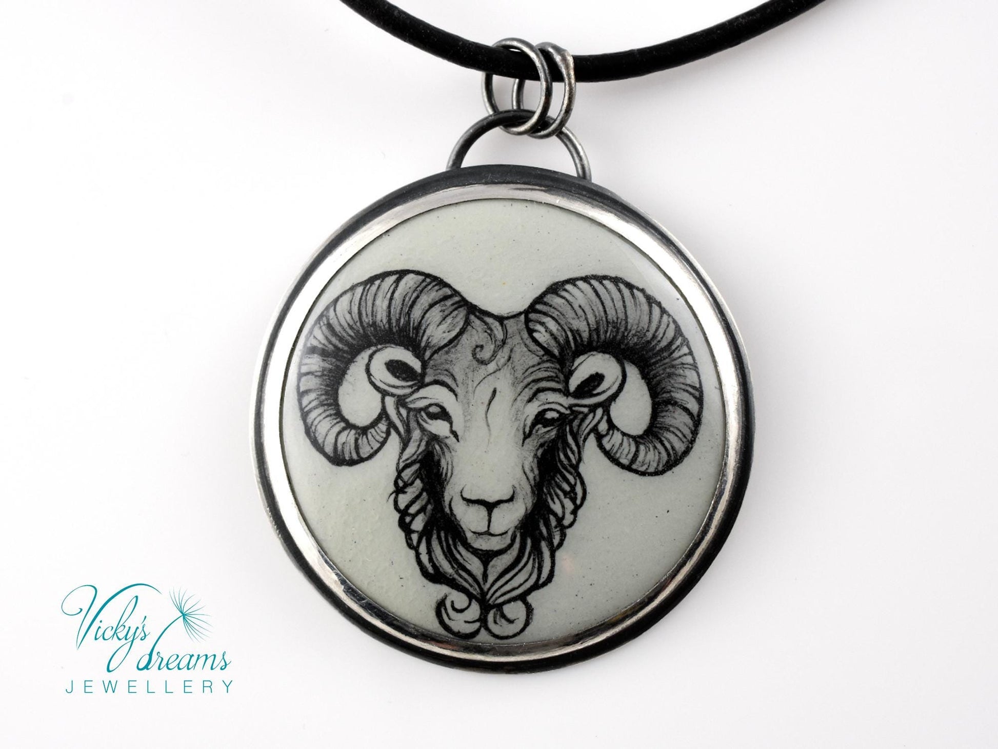 Hand-painted cloisonné enamel pendant featuring a zodiac sign design, set in sterling silver.