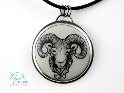 Hand-painted cloisonné enamel pendant featuring a zodiac sign design, set in sterling silver.