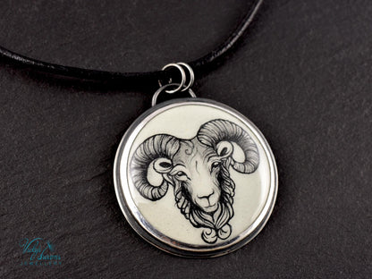 Hand-painted cloisonné enamel pendant featuring a zodiac sign design, set in sterling silver.