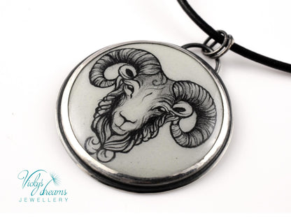 Hand-painted cloisonné enamel pendant featuring a zodiac sign design, set in sterling silver.