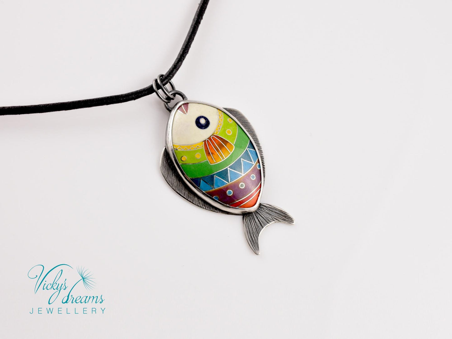 Hand-painted cloisonné enamel fish pendant in vibrant colors, set in sterling silver