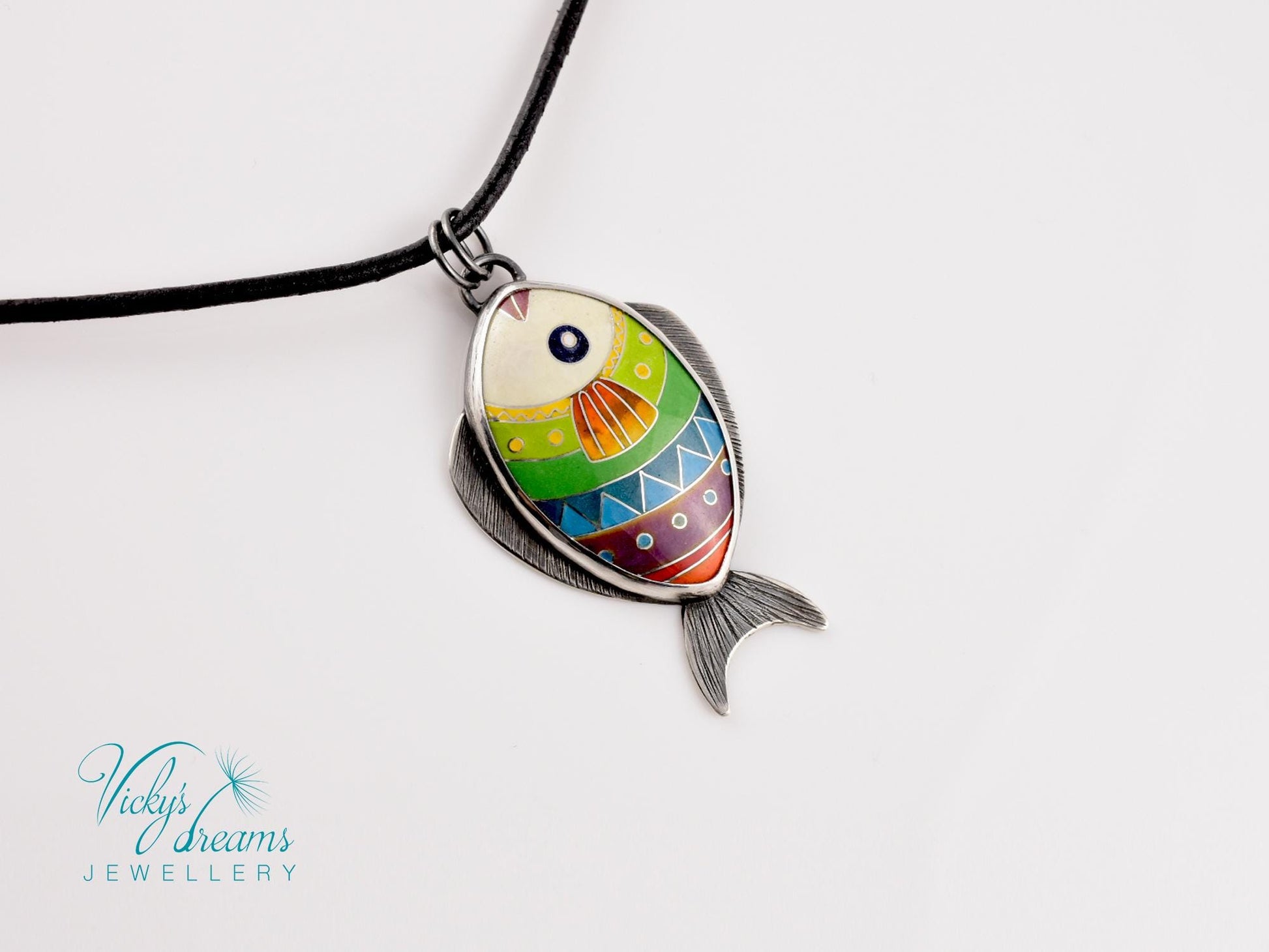 Hand-painted cloisonné enamel fish pendant in vibrant colors, set in sterling silver