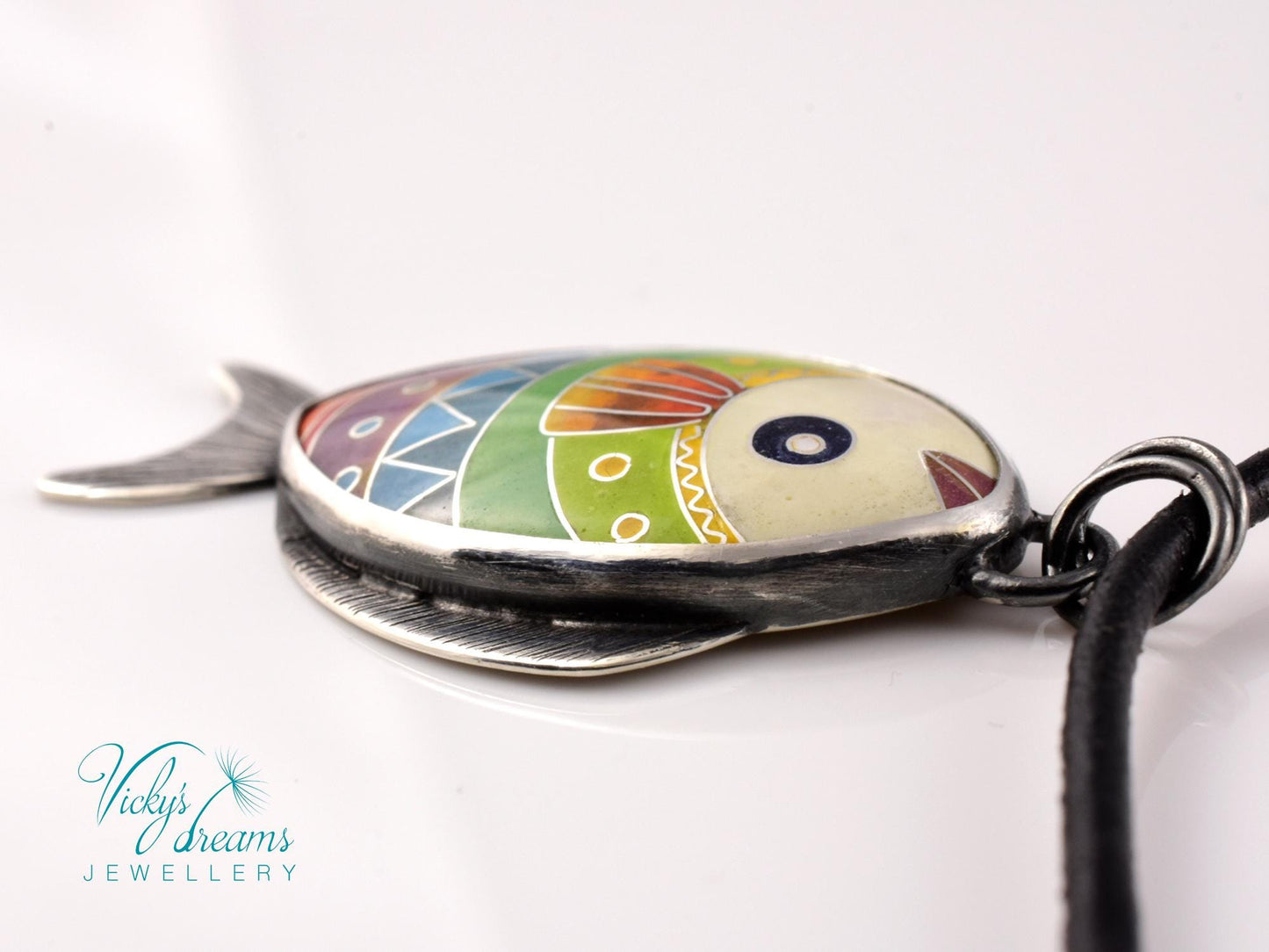 Hand-painted cloisonné enamel fish pendant in vibrant colors, set in sterling silver