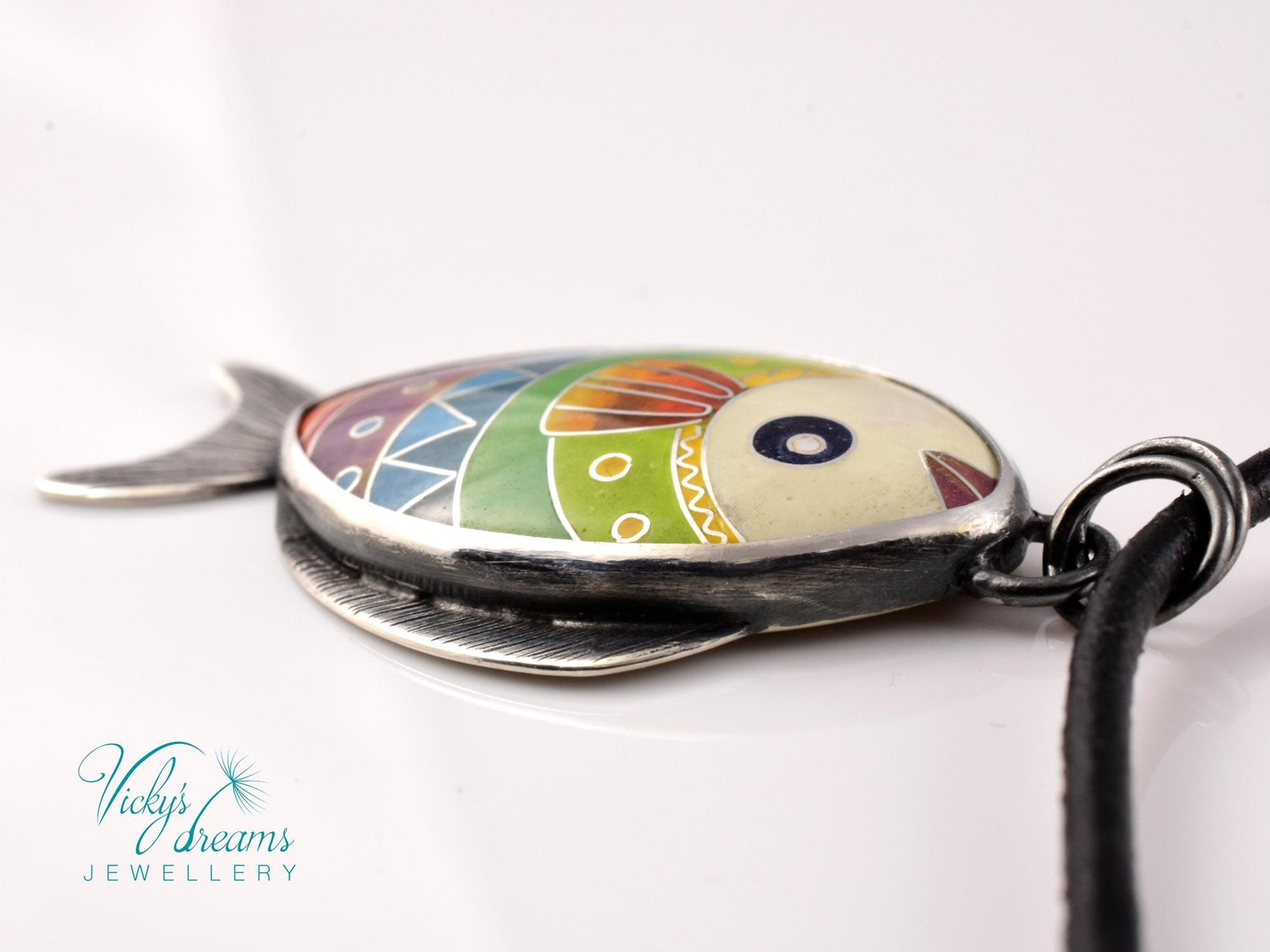 Hand-painted cloisonné enamel fish pendant in vibrant colors, set in sterling silver