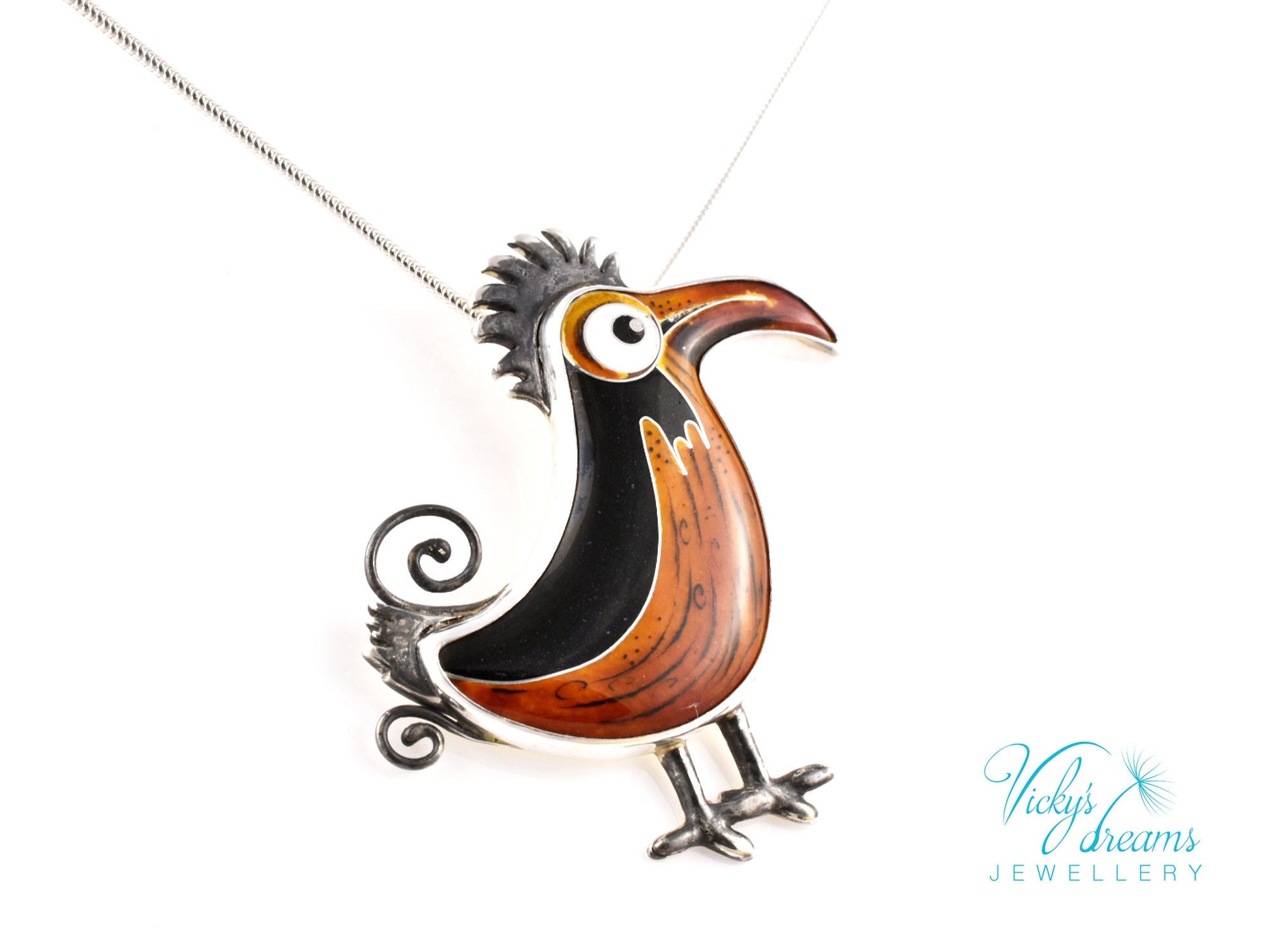 Handcrafted boho birdie pendant with cloisonné enamel and sterling silver frame, unique nature-inspired jewelry piece.