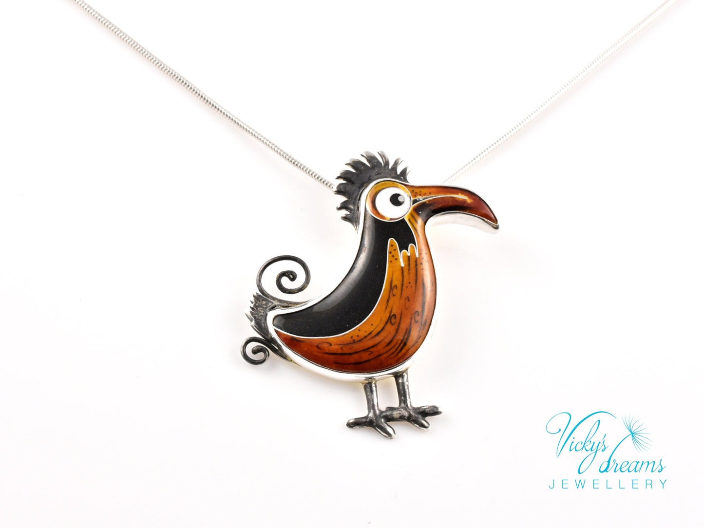 Handcrafted boho birdie pendant with cloisonné enamel and sterling silver frame, unique nature-inspired jewelry piece.